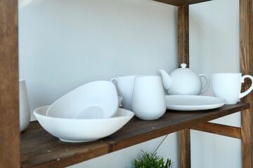A shelf with works made of white clay without firing. Ceramics, Pottery workshop. 