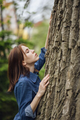 Portrait of beautiful young woman in forest.