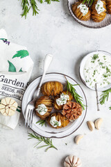 Baked potatoes with rosemary and garlic. © Алеся Макина