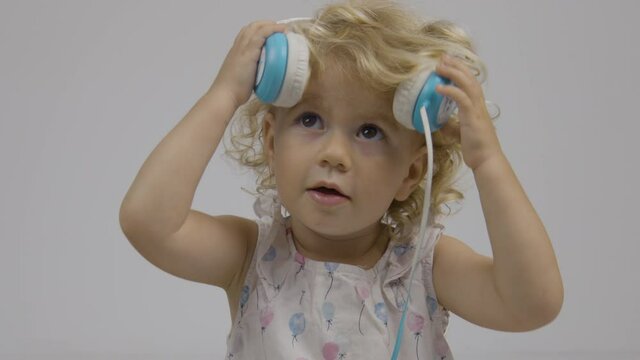 Baby girl dj with headphones