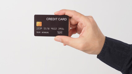 Hand is holding black credit card isolated on white background. Asian man hand.