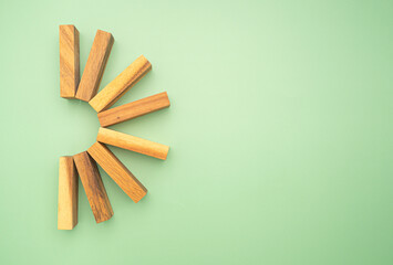 Top view of empty eight wooden blocks isolated on a green background