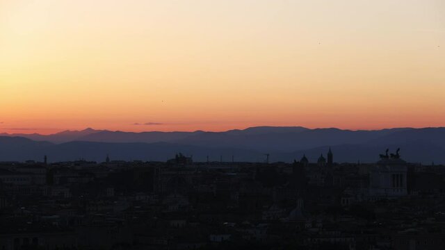Timelapse of Sunrise over ancient Rome from Gianicolo with many famous buildings and monuments, Rome, Italy