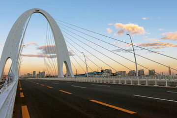 Fototapeta na wymiar Cable-stayed bridge with cloudy sky