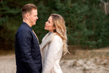 Fototapeta premium Happy loving couple enjoying of happiness love and tenderness, dating, romance.Couple hugging in love at spring park.