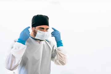 Fototapeta na wymiar Medical worker wearing surgical face mask preparing for operating room - Healthcare concept