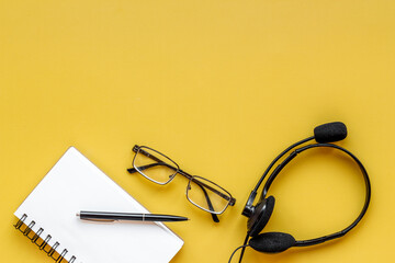 Communication support call center. Voip headset on offise desk