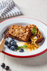 Slices of vegan fruit pie with cream, berries and fruit. Vegan dessert concept.