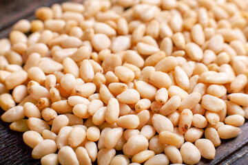 Background of Organic Pine nuts close up top view flat lay