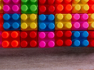 The Color toy bricks  on wood table for background or education concept