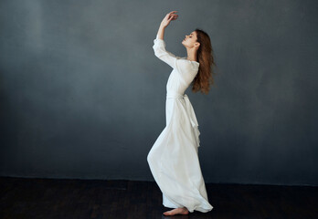 woman white dress fashion elegant style studio dark background posing