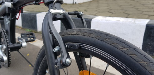 Fototapeta premium Bicycle parts of folding bike such as wheel, gears, disc brake and rear derailleur