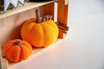 Crocheted orange pumpkin for autumn home decor.