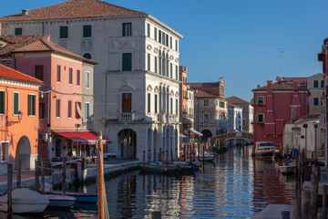 Fototapeta na wymiar Chioggia, Venezia. Canal Vena con Palazzo Grassi e fondamenta.