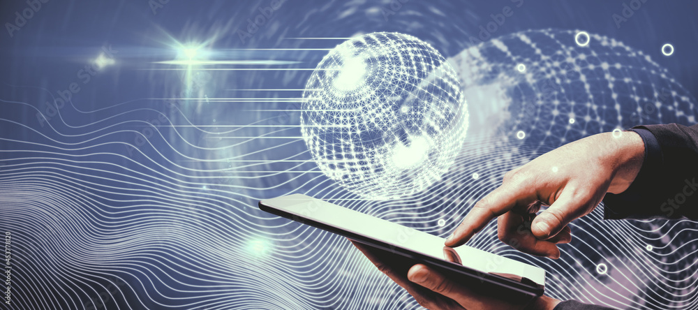 Poster businessman hand pointing at tablet with creative glowing polygonal globe interface on blue backgrou
