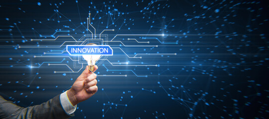 Hand holding glowing light bulb with creative glowing digital hud interface background with circuit and polygonal mesh network. Innovation, future and artificial intelligence concept.