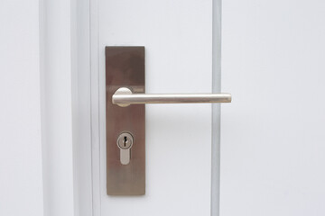 Modern house door handle and key slot.