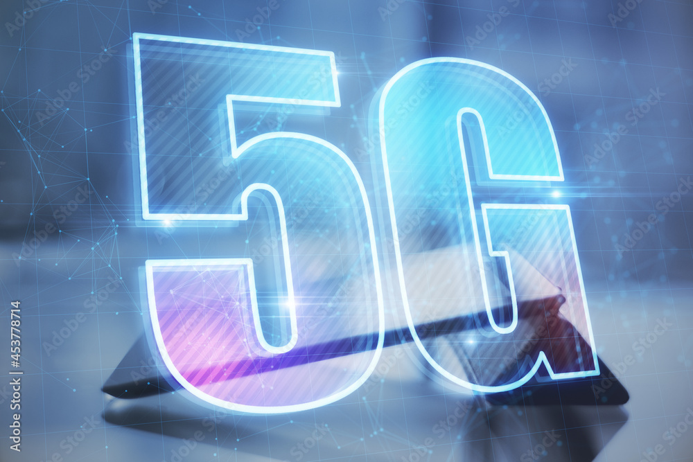 Poster Close up of desktop with tablet and abstract glowing 5G hologram on dark blue background. Wireless infomation and future technology concept. Double exposure.