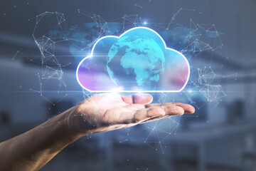 Female hand holding abstract glowing cloud hologram on blurry interior background. Cloud computing, future and data storage concept. Double exposure.