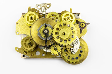The old mechanism of bronze gears insulated on a white background.