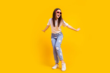 Fototapeta na wymiar Full length photo of young excited girl happy positive smile excited enjoy isolated over yellow color background
