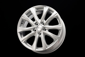 Obraz premium alloy wheel close-up. New modern auto parts, black background