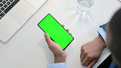Top View of Smartphone with Green Chroma Key Screen