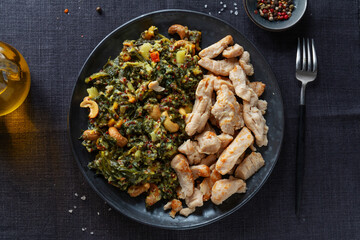 Green kale salad with chicken on plate