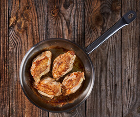 Seared chicken breasts in a pan