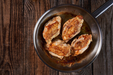Seared chicken breasts in a pan