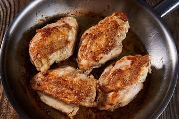 Seared chicken breasts in a pan