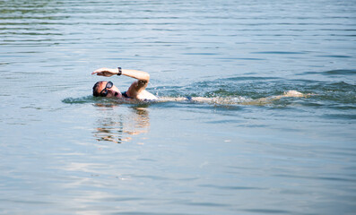woman swimming in open water lake