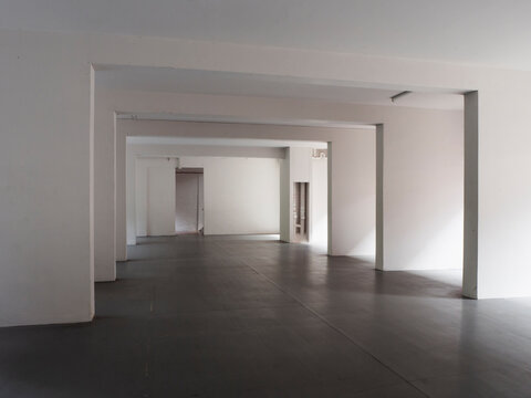 Abstract, Empty Void Deck Of An Apartment Block With Sunlight Streaming In