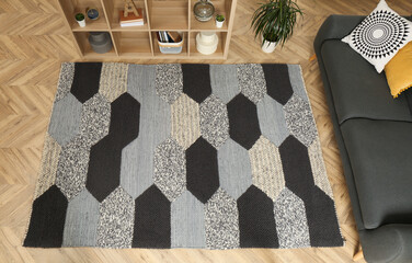Modern living room interior with grey carpet and stylish furniture, above view