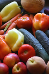 Various colorful summer fruit and vegetable on dark background. Selective focus.