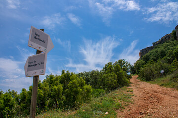 Sign on a hiking trail to the top of the mountain