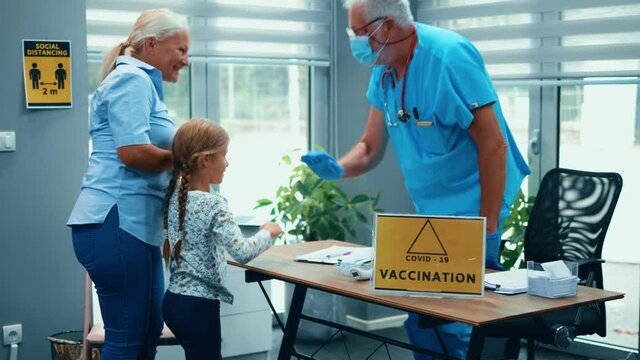 Parent takes the little girl to clinic to get vaccinated. Little girl enters the doctor's office for immunization