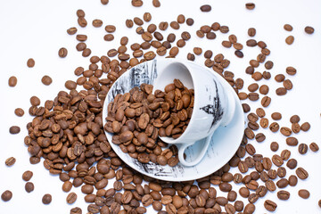 coffee cup full of coffee grains on white table