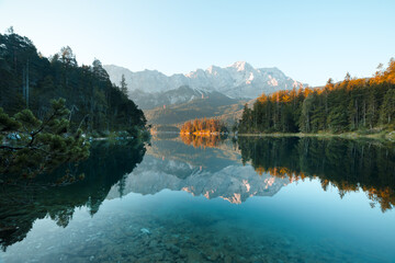 Naklejka premium Fantastic morning on mountain lake Eibsee, located in the Bavaria, Germany. Dramatic unusual scene. Alps, Europe. Landscape photography