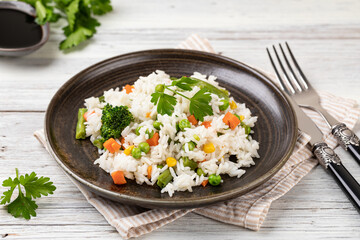 Bowl with tasty rice and vegetables
