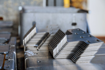 Sheet metal product after processing on a bending machine. Production of fastening from metal for...