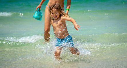 Happy Baby Boy on the Beach