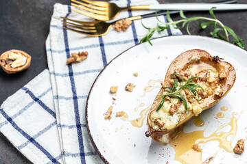 Pear with blue, cheese, honey and walnuts on light background. Healthy and diet food. Top view