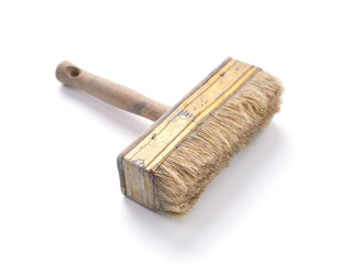 Old used paintbrush tool isolated on white background. Construction paint brush