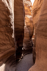 Narrow  passage between rocks in a nature reserve near Eilat city - Red Canyon, in southern Israel