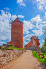Old Turaida castle with tower in a sunny day. Summer landscape. Gauja national park, Sigulda, Latvia