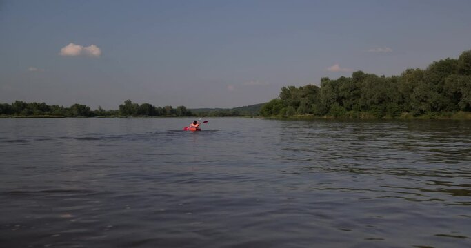 Kayaking on the River. Girls tourists kayaking down the river, teamwork. canoes on the river