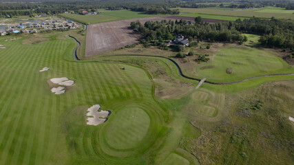 Beautiful drone aerial view of Golf Course with freshly mown grass 
