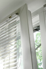 Blinds attached to the window, close-up.