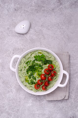 Mashed potatoes with tomatoes and green sauce